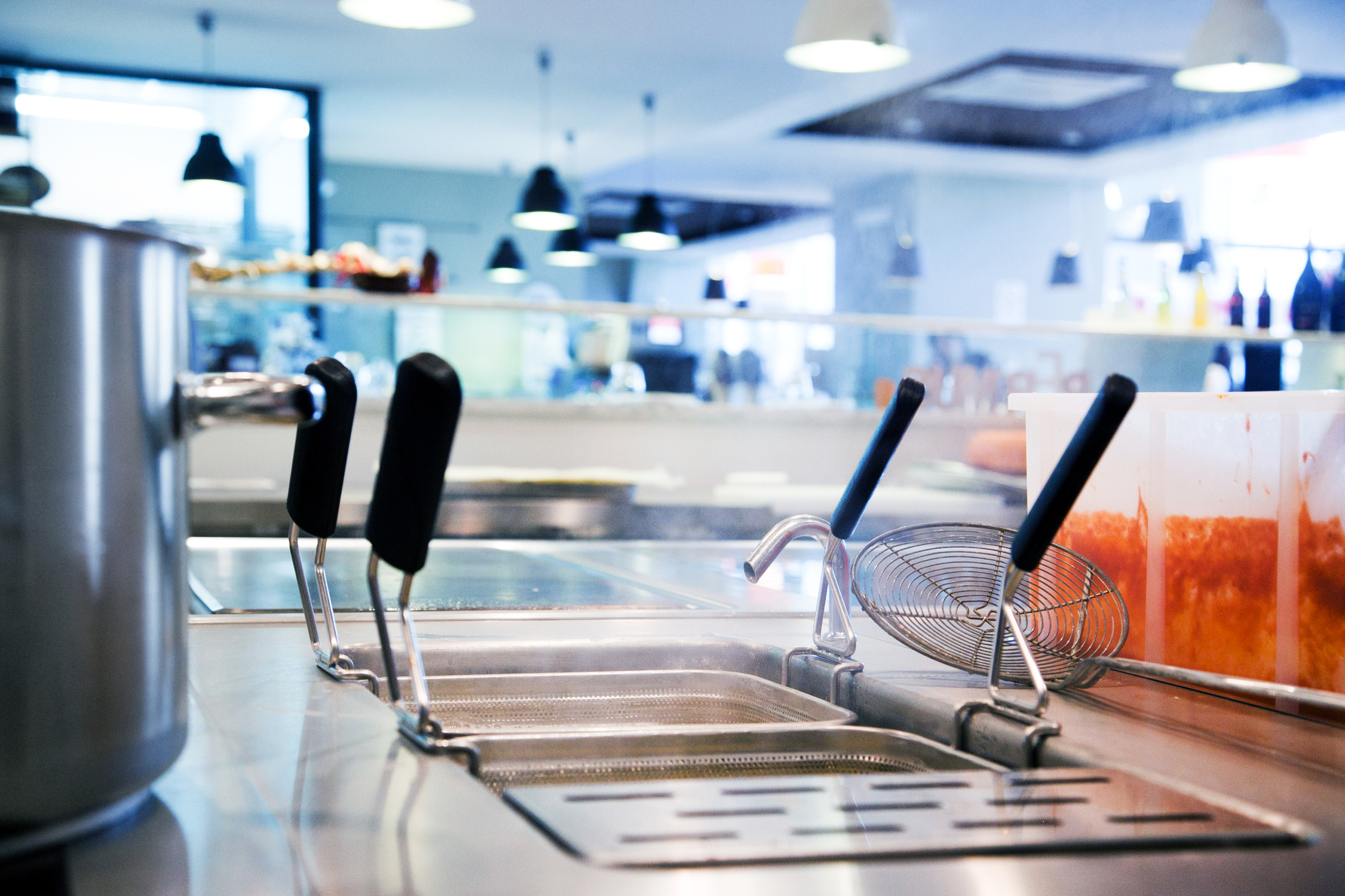 Restaurant kitchen close up of fryers