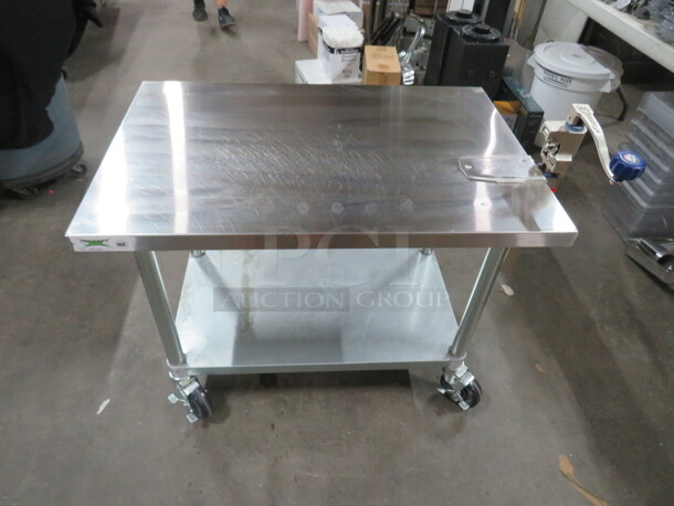 One Stainless Steel Table With Under Shelf And 10lb Edlund Can Opener, On Casters. 36X24X28 - Image 2 of 5