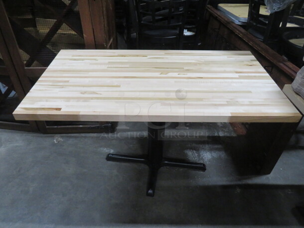 One Wooden Butcher Block Table Top On A Pedestal Base. 48X25X29.5 - Image 1 of 2