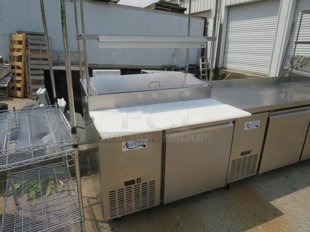 One Stainless Steel Avantco 1 Door Refrigerated Prep Table With 2 SS Over Shelves, 1 Rack, 36 Inch Ticket Rail, And  Cutting Board On Casters. Model# 178SSPPT-1. 115 Volt. 44.5X37X73.  - Image 2 of 4