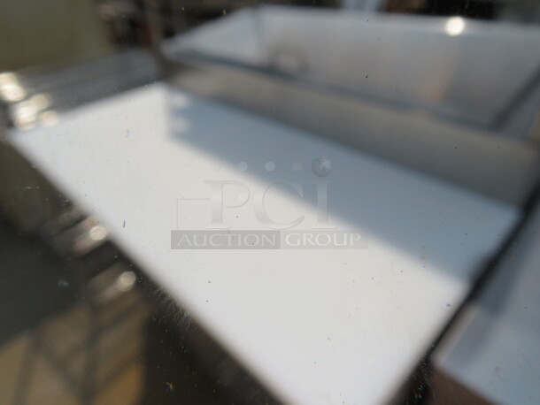 One Stainless Steel Avantco 1 Door Refrigerated Prep Table With 2 SS Over Shelves, 1 Rack, 36 Inch Ticket Rail, And  Cutting Board On Casters. Model# 178SSPPT-1. 115 Volt. 44.5X37X73.  - Image 4 of 4