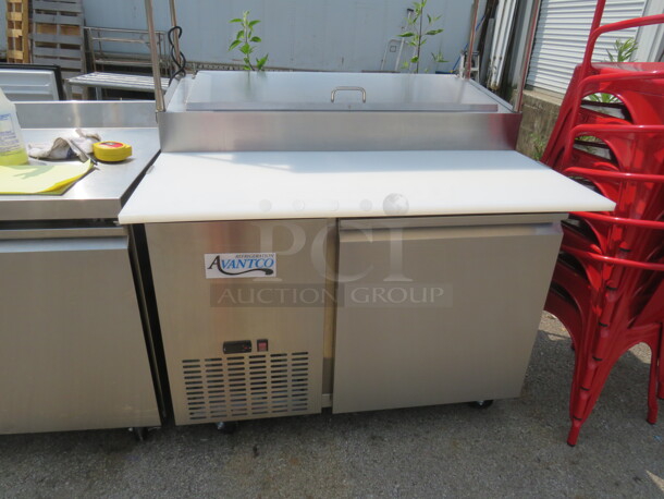 One Stainless Steel Avantco 1 Door Refrigerated Prep Table With 2 SS Over Shelves, 1 Rack, 36 Inch Ticket Rail, And  Cutting Board On Casters. Model# 178SSPPT-1. 115 Volt. 44.5X37X73.  - Image 2 of 6