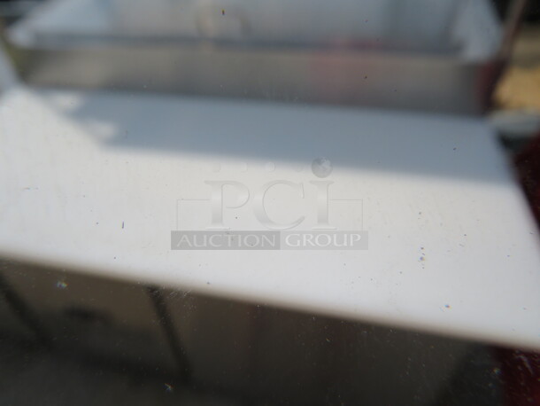 One Stainless Steel Avantco 1 Door Refrigerated Prep Table With 2 SS Over Shelves, 1 Rack, 36 Inch Ticket Rail, And  Cutting Board On Casters. Model# 178SSPPT-1. 115 Volt. 44.5X37X73.  - Image 5 of 6