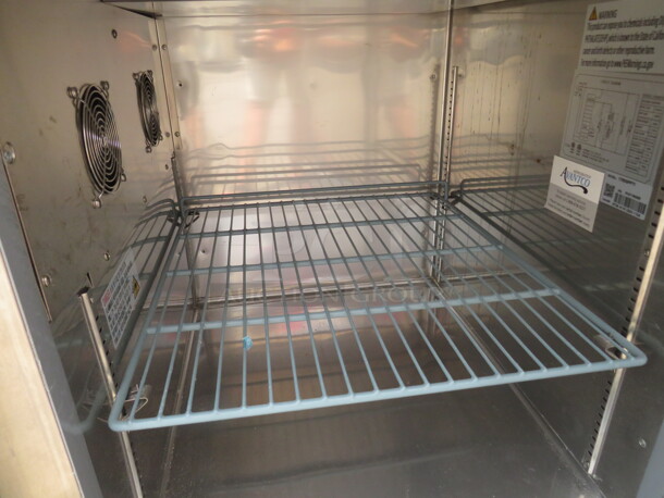 One Stainless Steel Avantco 1 Door Refrigerated Prep Table With 2 SS Over Shelves, 1 Rack, 36 Inch Ticket Rail, And  Cutting Board On Casters. Model# 178SSPPT-1. 115 Volt. 44.5X37X73.  - Image 6 of 6