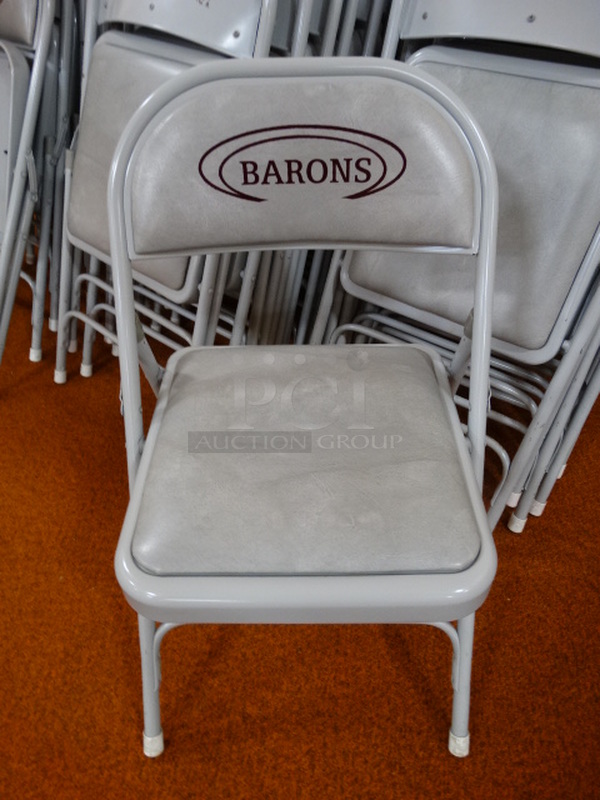 8 Metal Folding Chairs w/ Gray Seat Cushion and Barons Logo on Backrest. 18x20x30. 8 Times Your Bid! (Gym)
