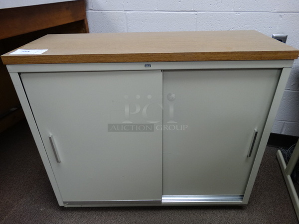 Metal Tan 2 Door Cabinet w/ Wood Pattern Countertop. 35x13x30. (Main School Office)