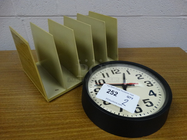 2 Items; Clock and Metal Organizer. 10x10x2.5, 9x13x8. 2 Times Your Bid! (Main School Office)