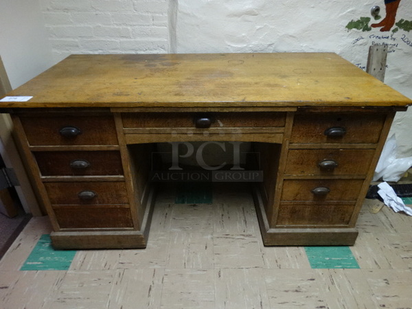 Wood Pattern Desk w/ 6 Drawers. 60x30x31. (Basement Hallway)