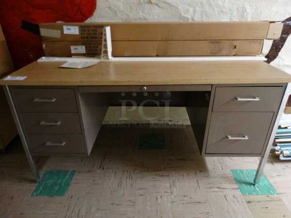 Metal Desk w/ Wood Pattern Desktop and 5 Drawers. 60x30x29. (Basement Hallway)