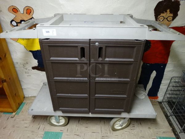 Rubbermaid Poly Cleaning Cart on Commercial Casters. 58x23x51. (Basement Hallway)