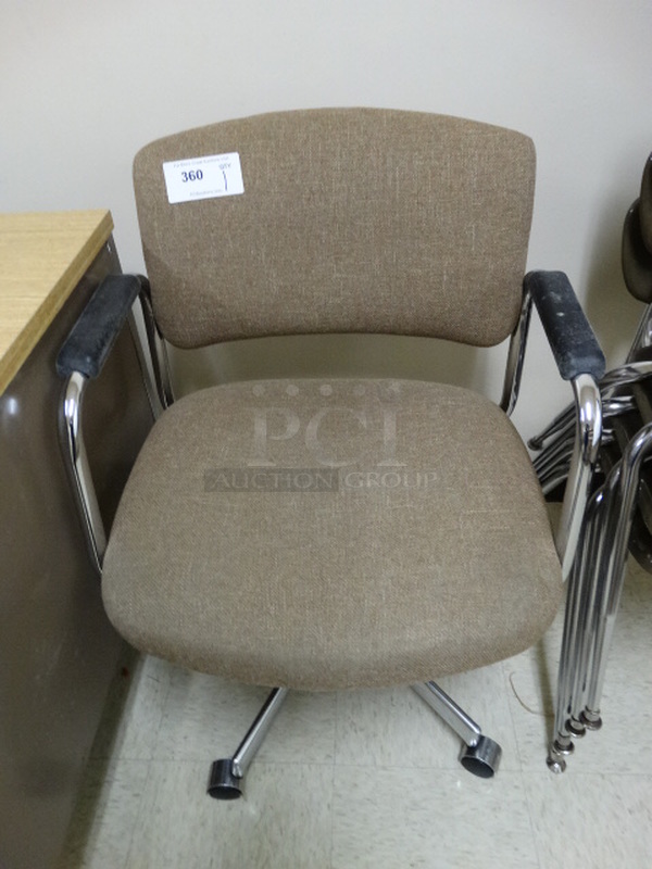 Tan Office Chair w/ Arm Rests on Casters. 24x21x34. (Downstairs Room 6)