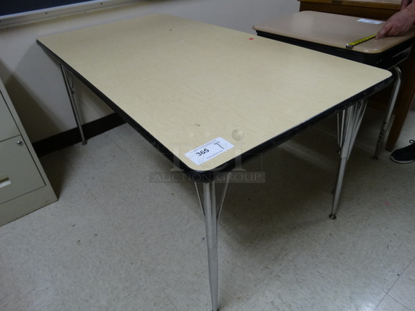 Table on Metal Legs. 60x30x28. (Downstairs Room 6)