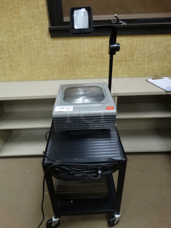 3M Overhead Projector on Metal 2 Tier AV Cart on Commercial Casters. 18x25x26, 15x17x28. (Room 110)