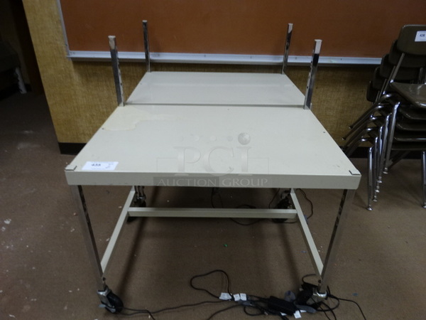 2 Metal Portable Tables on Commercial Casters. 36x24x39. 2 Times Your Bid! (Room 110)