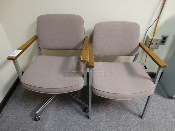 2 Chairs w/ Pink Cushions w/ Arm Rests. 1 on Casters. 23x21x32. 2 Times Your Bid! (Room 109)