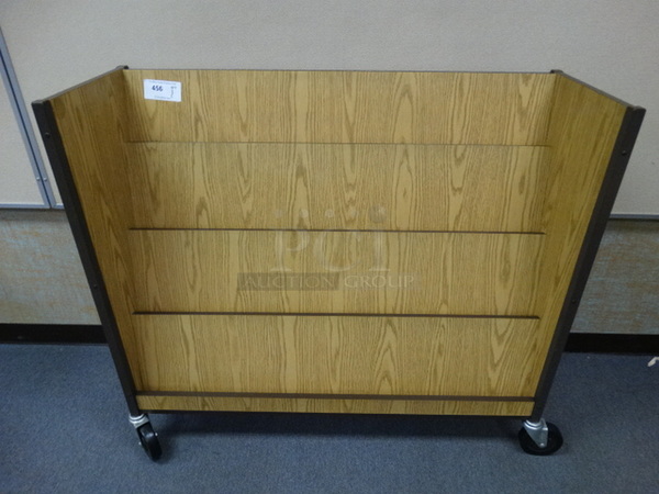 Wood Pattern Magazine Rack on Commercial Casters. 48x17x42. (Room 108)
