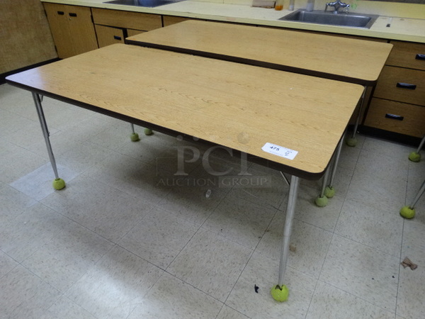 2 Wood Pattern Tables on Metal Legs. 60x30x28. 2 Times Your Bid! (Room 107)