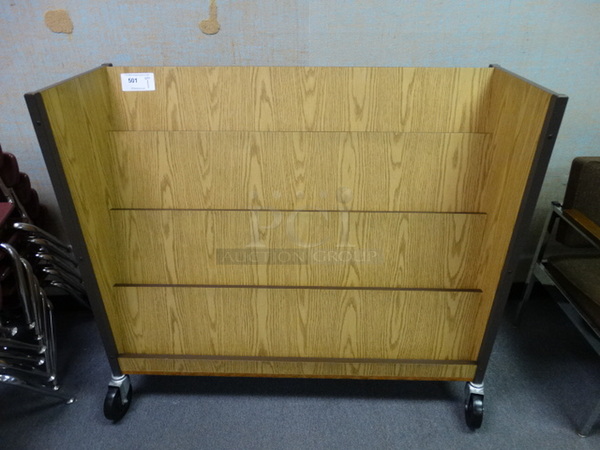 Wood Pattern Magazine Rack on Commercial Casters. 48x17x42. (Room 105)