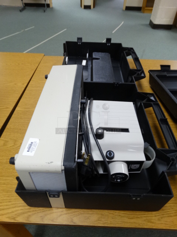 Dukane Model 28A81C Filmstrip Projector in Case. 16x6x12. (Library)
