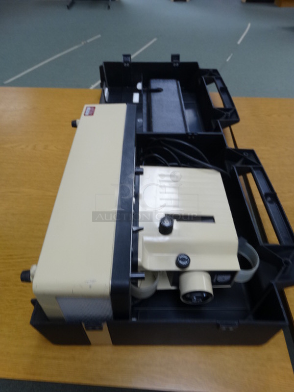 Dukane Model 28A81B Filmstrip Projector in Case. 16x6x12. (Library)