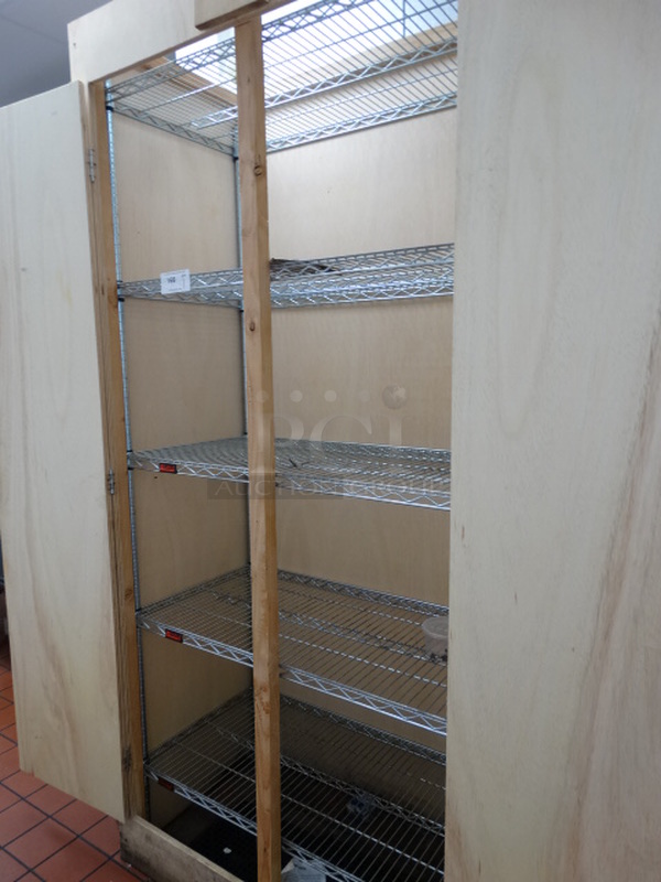 Eagle Chrome Finish 5 Tier Shelving Unit in Wooden Lockable Cabinet. Buyer Must Remove. 42x21x83. BUYER MUST DISMANTLE. PCI CANNOT DISMANTLE FOR SHIPPING. PLEASE CONSIDER FREIGHT CHARGES.