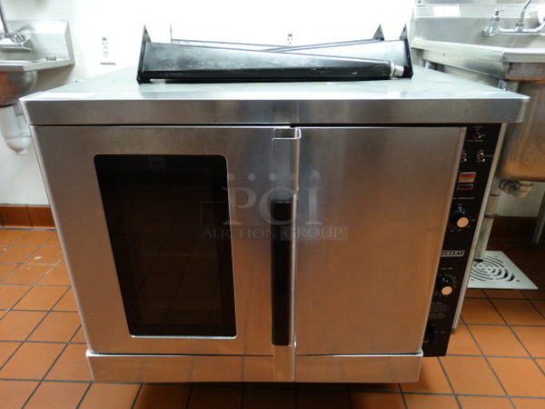 FANTASTIC! Hobart Stainless Steel Commercial Propane Gas Powered Full Size Convection Oven w/ View Through Door, Solid Door, Metal Oven Racks and Thermostatic Controls. Comes w/ Metal Legs! 38x36x35. Tested and Working!