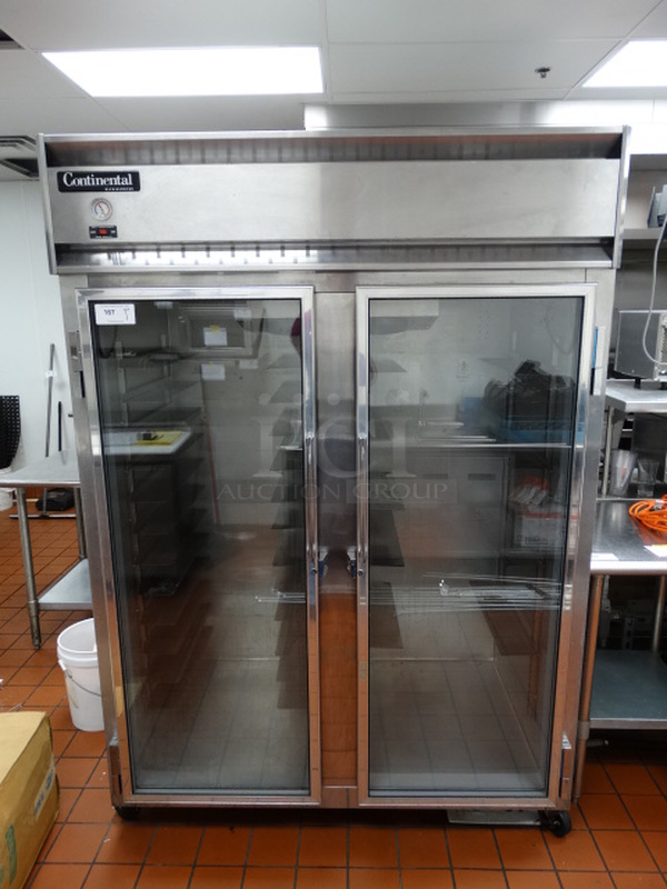 FANTASTIC! Continental Model 2RE-GD Stainless Steel Commercial 2 Door Reach In Cooler Merchandiser w/ Tray Slides on Commercial Casters. 115 Volts, 1 Phase. 57x34x83. Tested and Working!