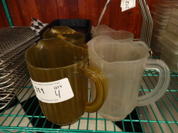 4 Poly Clear and Amber Colored Pitchers. 8x5x9. 4 Times Your Bid!
