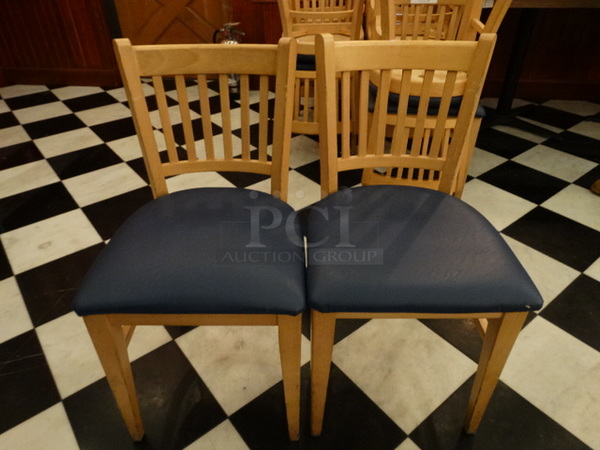 4 Light Wood Pattern Dining Chairs w/ Blue Seat Cushion. Stock Picture - Cosmetic Condition May Vary. 16x18x31. 4 Times Your Bid!