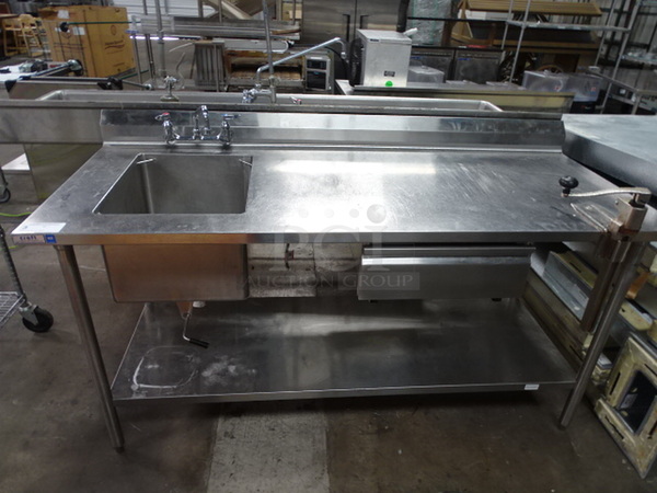 Stainless Steel Utility Table With Sink Bay, Faucet, Back Splash Guard, Can Opener, And Shelf Underneath. 