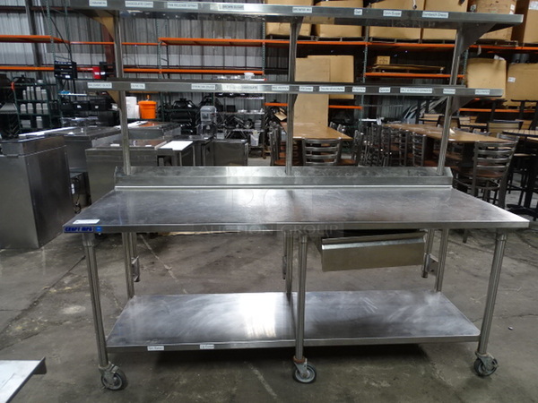 Stainless Steel Utility Table On Commercial Casters With 2 Overhead Shelves And Shelf Underneath. 