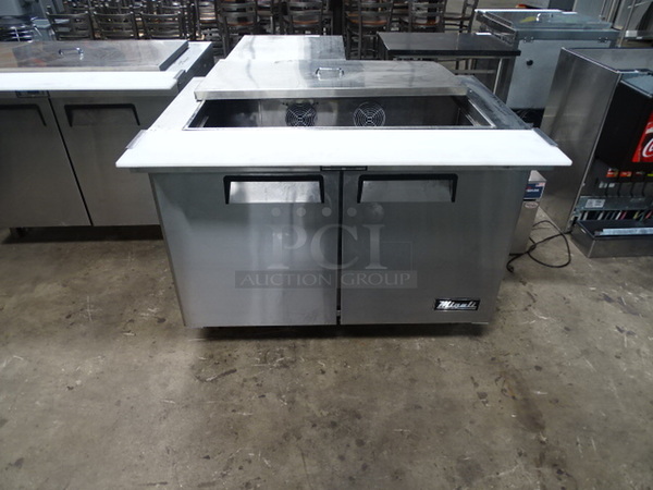 NICE! Migali Stainless Steel Commercial 2-Door, Refrigerated Prep Table On Commercial Casters With Cutting Board Attachment And Interior Shelves. 115 Volts, 60 Hertz, & 1 Phase. TESTED & WORKS!