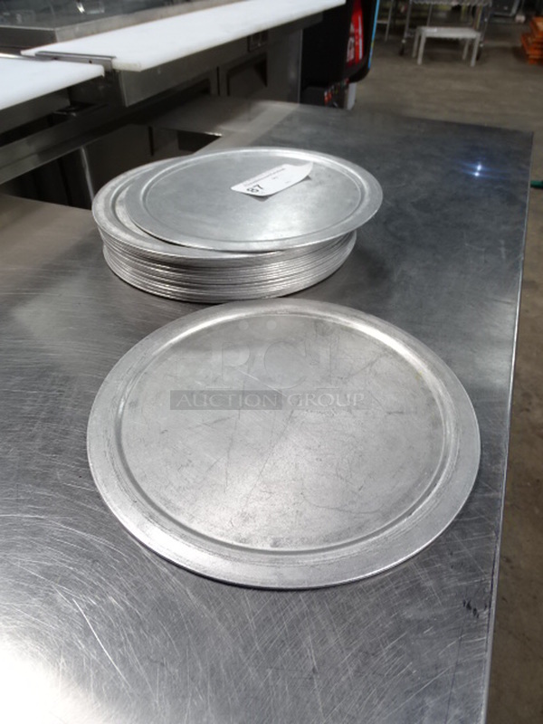 25 Times Your Bid. 24 Round, Aluminum Baking Sheets. PICTURE IS A STOCK PHOTO. COSMETIC DIFFERENCES MAY OCCUR. 