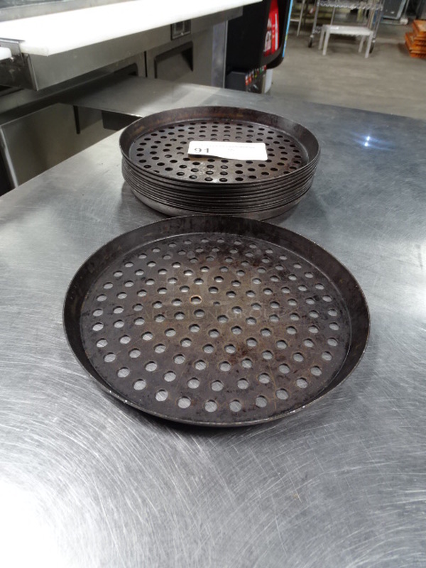 17 Times Your Bid. 17 Round, Perforated Baking Pans. PICTURE IS A STOCK PHOTO. COSMETIC DIFFERENCES MAY OCCUR. 