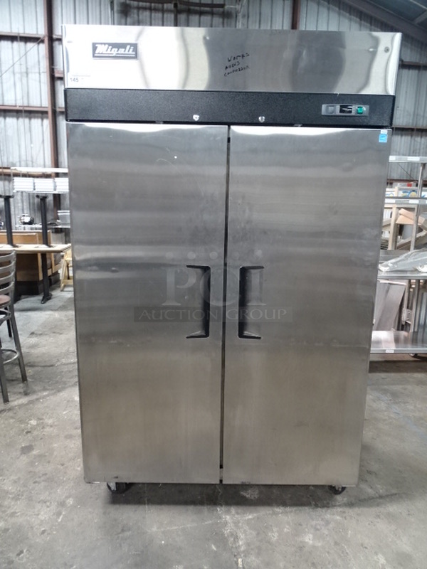 WOW! Migali Model C-2F Stainless Steel Commercial 2-Door, Reach-In Freezer On Commercial Casters With Interior Shelves. 115 Volts, 60 Hertz, & 1 Phase. TESTED & TURNS ON. DOESN'T COOL.