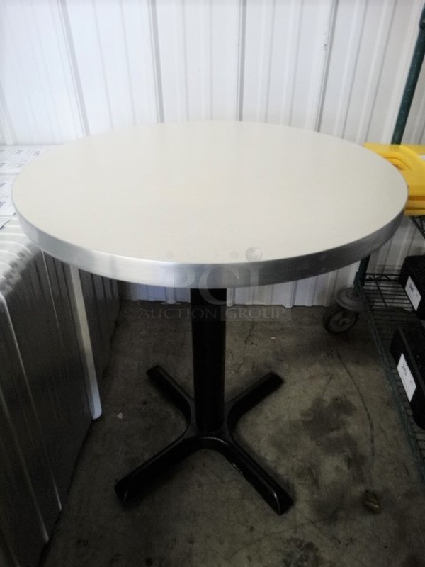 White Round Tabletop on Black Metal Table Base. Stock Picture - Cosmetic Condition May Vary. 24x24x30