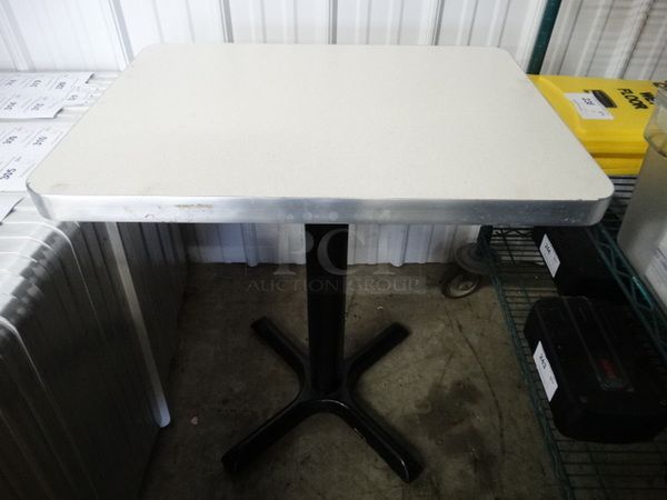 White Rectangular Tabletop on Black Metal Table Base. Stock Picture - Cosmetic Condition May Vary. 24x18x30