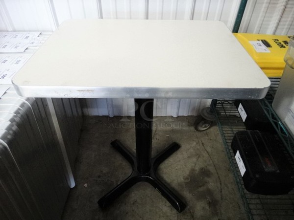 White Rectangular Tabletop on Black Metal Table Base. Stock Picture - Cosmetic Condition May Vary. 24x18x30