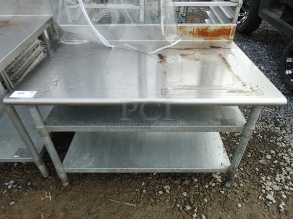 Stainless Steel Commercial Table w/ 2 Metal Undershelves. 48x30x33
