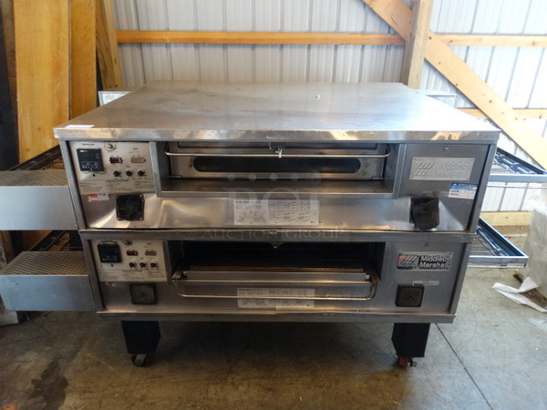 2 Middleby Marshall Model PS570G Stainless Steel Commercial Natural Gas Powered Conveyor Pizza Oven on Commercial Casters. 170,000 BTU. 107x56x60