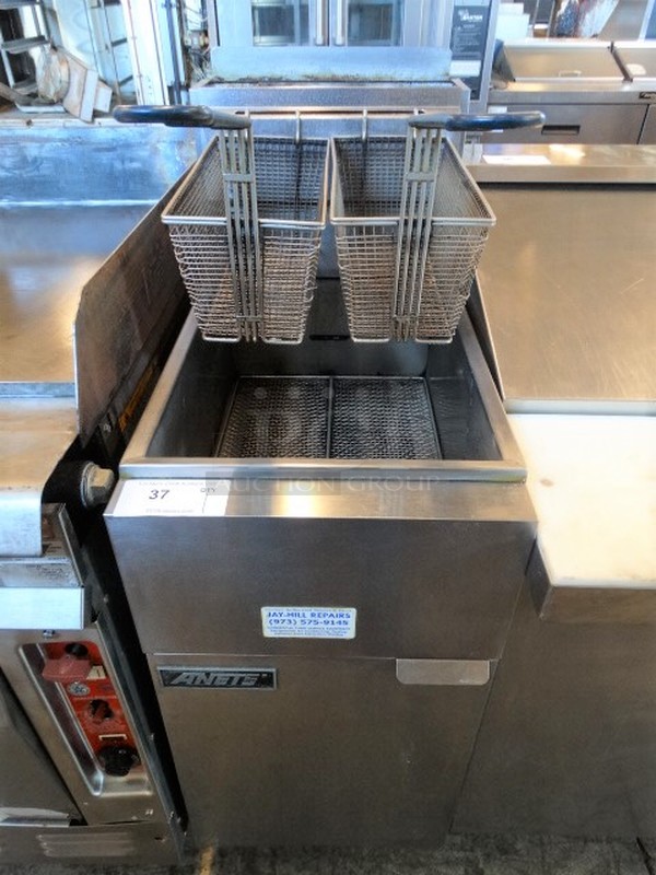 NICE! Anets Model 14VFS Stainless Steel Commercial Natural Gas Powered Deep Fat Fryer w/ 2 Metal Fry Baskets. 90,000 BTU. 16x30x47
