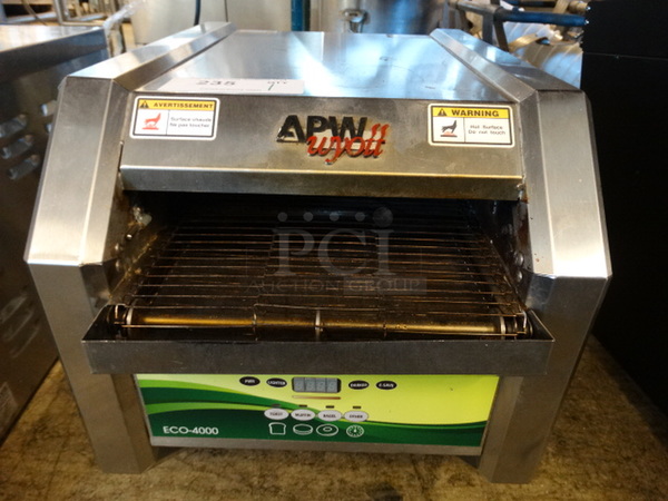NICE! APW Wyott Model ECO-4000 Stainless Steel Commercial Countertop Electric Powered Conveyor Toaster Oven. 120 Volts, 1 Phase. 15x21x16. Tested and Working!