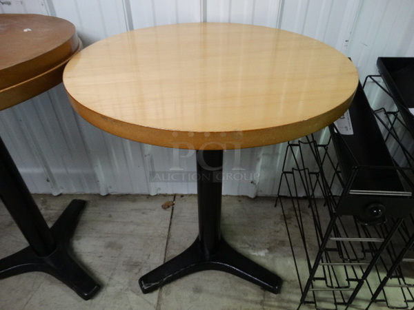 Wooden Round Tabletop on Black Metal Table Base. Stock Picture - Cosmetic Condition May Vary. 24x24x30