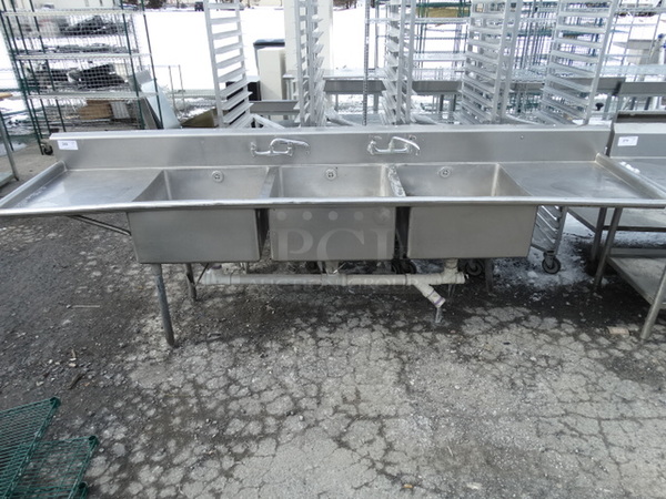 Stainless Steel Commercial 3 Bay Sink w/ Dual Drainboards, 2 Faucets and Handles. 124x29x41. Bays 24x24x12. Drainboards 22x26x2