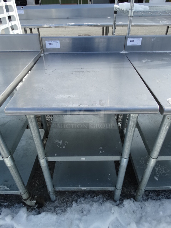 Stainless Steel Commercial Table w/ 2 Metal Undershelves. 24x30x40