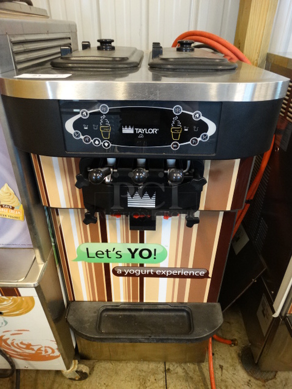 FANTASTIC! 2013 Taylor Model C723-33 Stainless Steel Commercial Water Cooled 2 Flavor w/ Twist Soft Serve Ice Cream Machine on Commercial Casters. 208-230 Volts, 3 Phase. 23x34x55. Tested and Working!