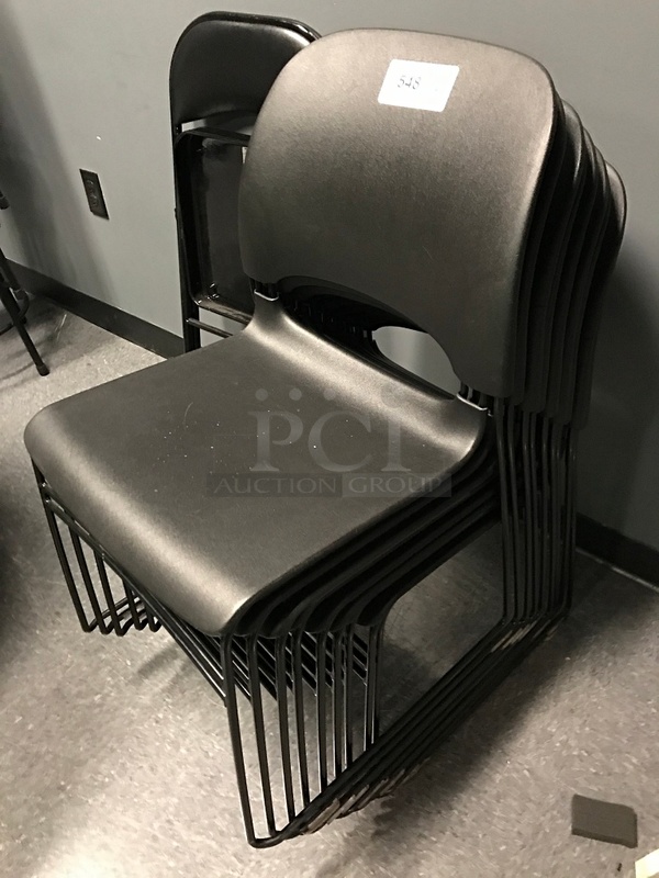 Nine Black Stackable Chairs