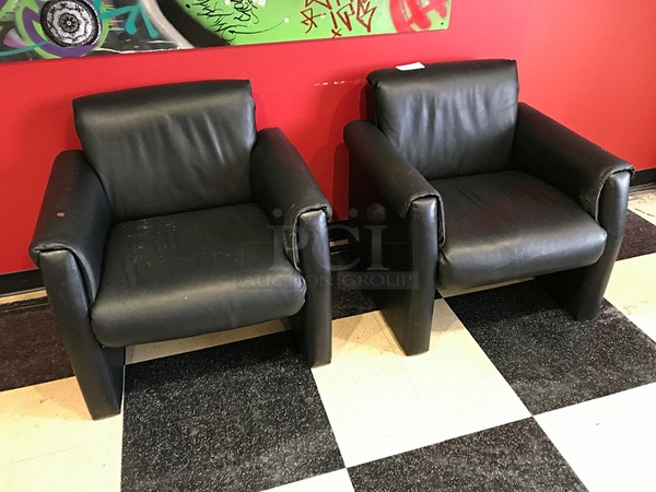 Two Leather Lounge Chairs