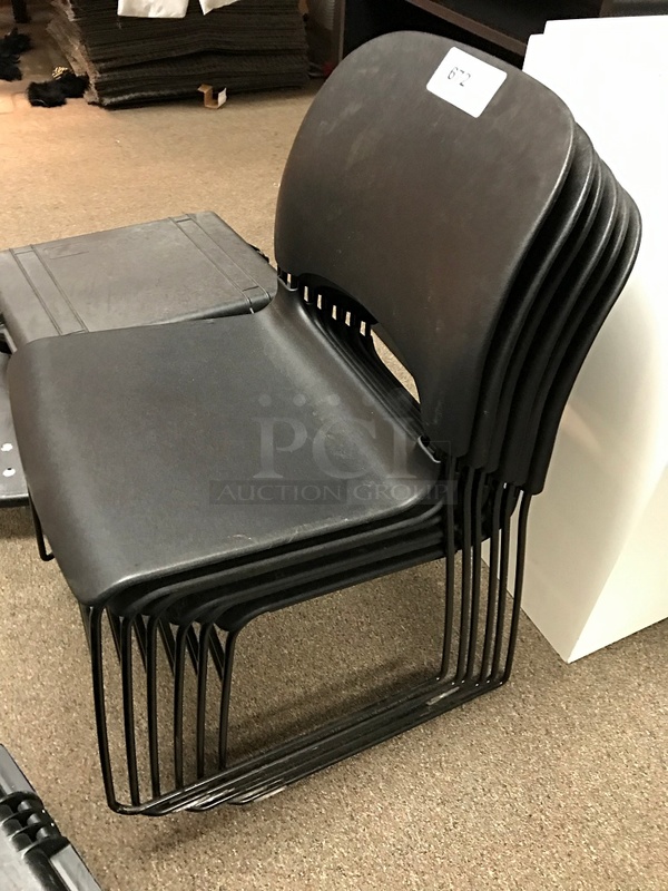 Six Stackable Black Plastic Chairs