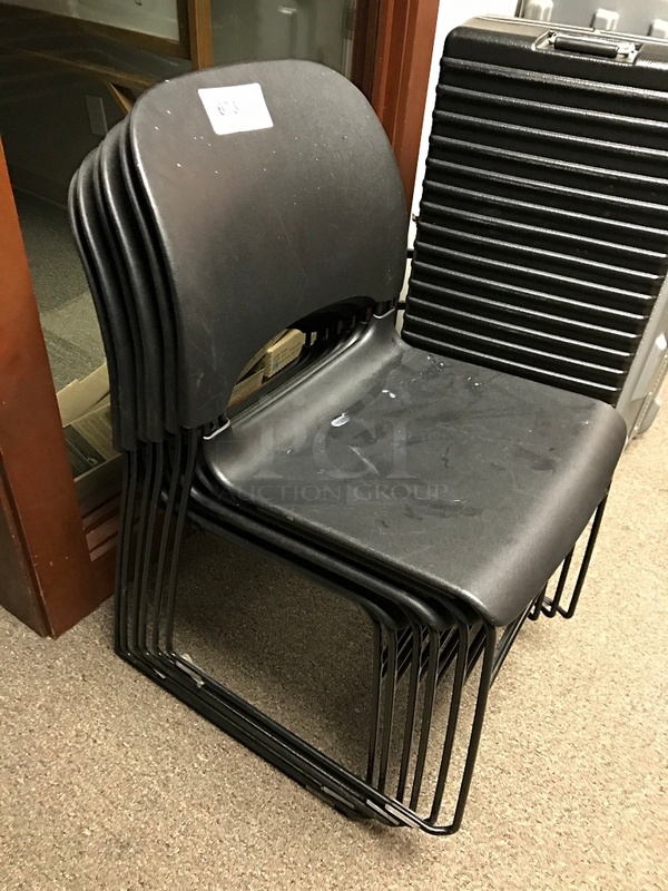 Six Stackable Black Plastic Chairs
